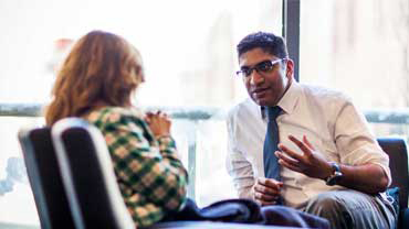 Dr. Thomas talking with a patient