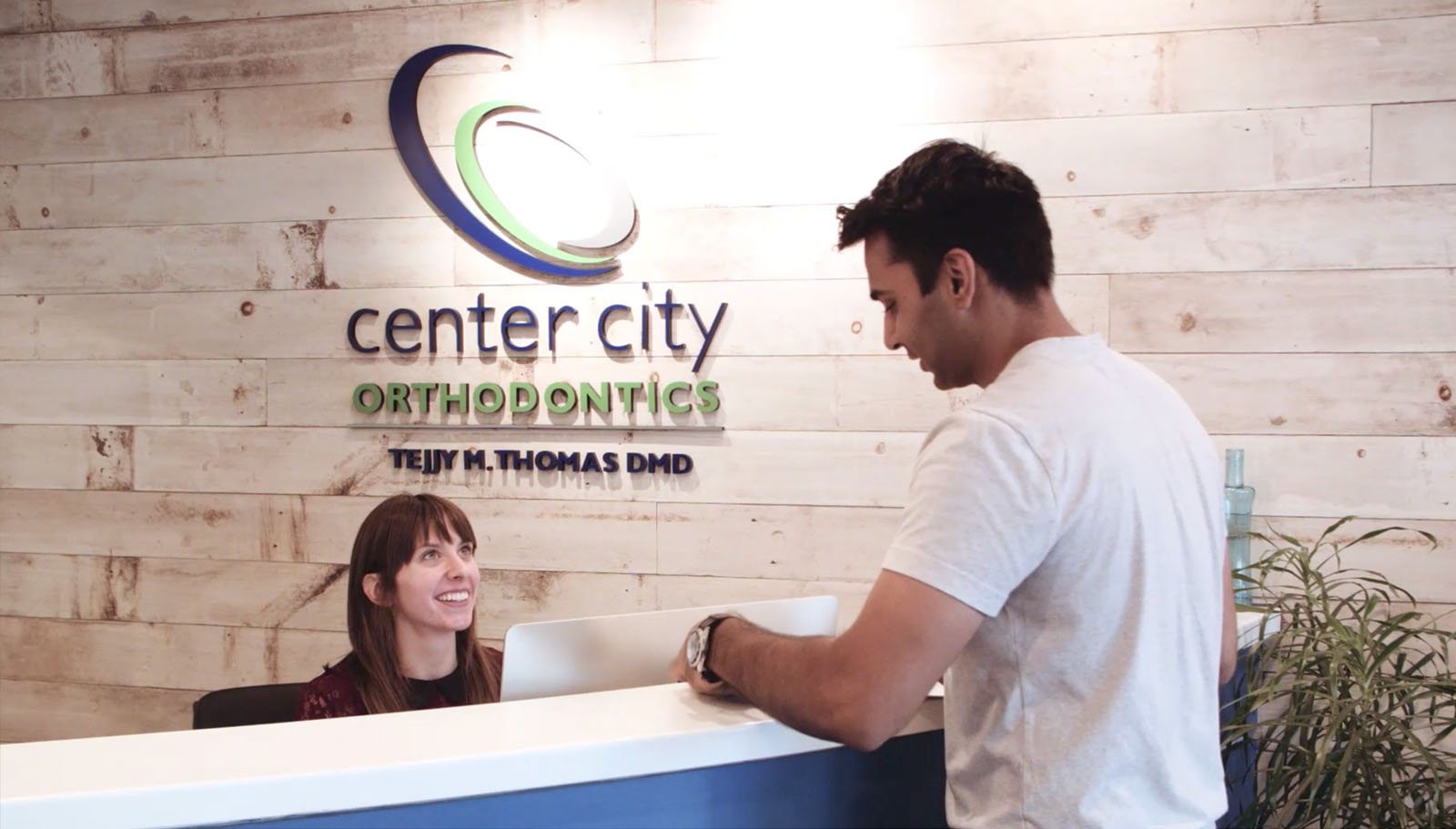 Patients chatting at the Center City Orthodontics front desk