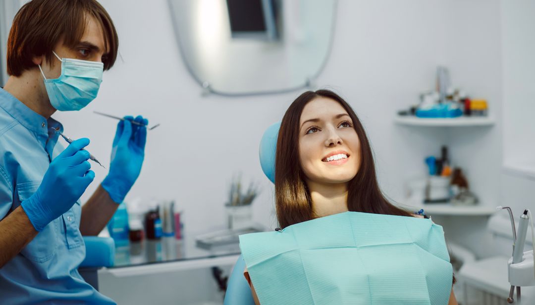 A smiling patient in the dental chair