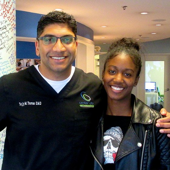 Dr. Thomas with a smiling young woman