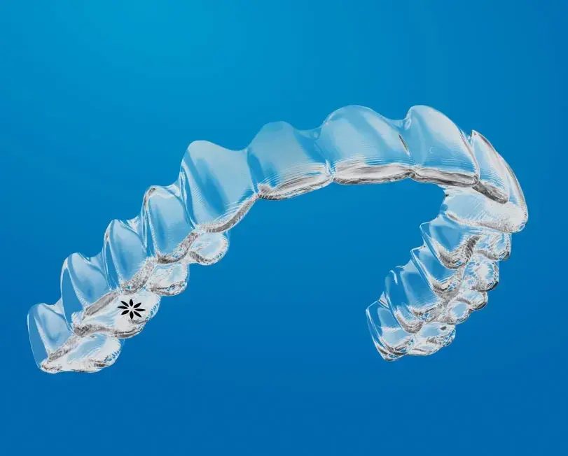 Clear aligner on a blue background