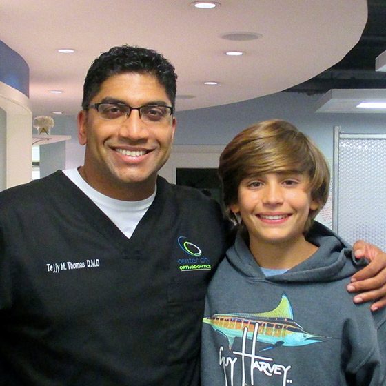 Dr. Thomas with a patient