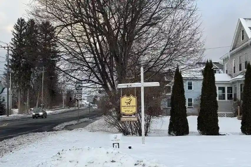 The Smileworks sign on South Street in winter