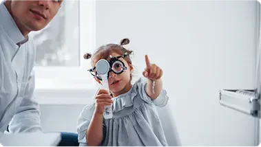 A child trying on a trial frame at Vision Studio